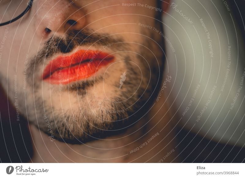 Breaking down gender roles. A person with a beard and red lipstick made up. Facial hair Lipstick masculine feminine Feminine Transgender trans crossdressing