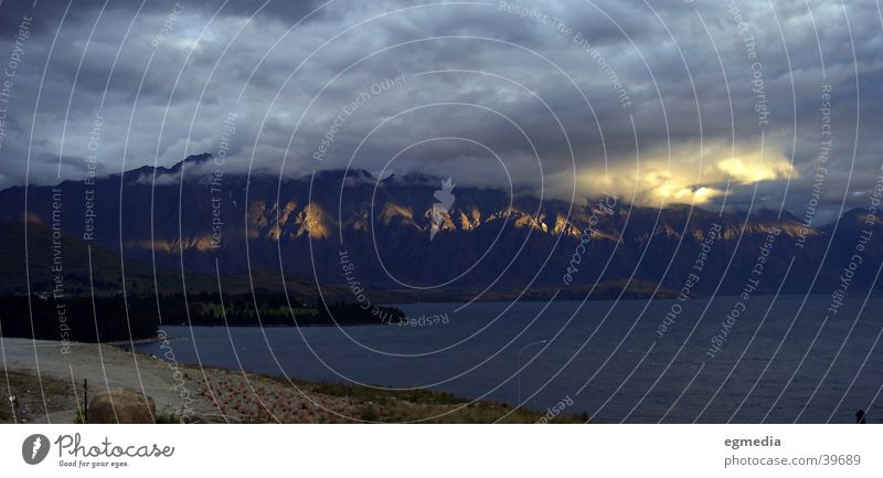 Lake Wakatipu Clouds Queenstown Light Mountain sun streak New Zealand Rock Weather