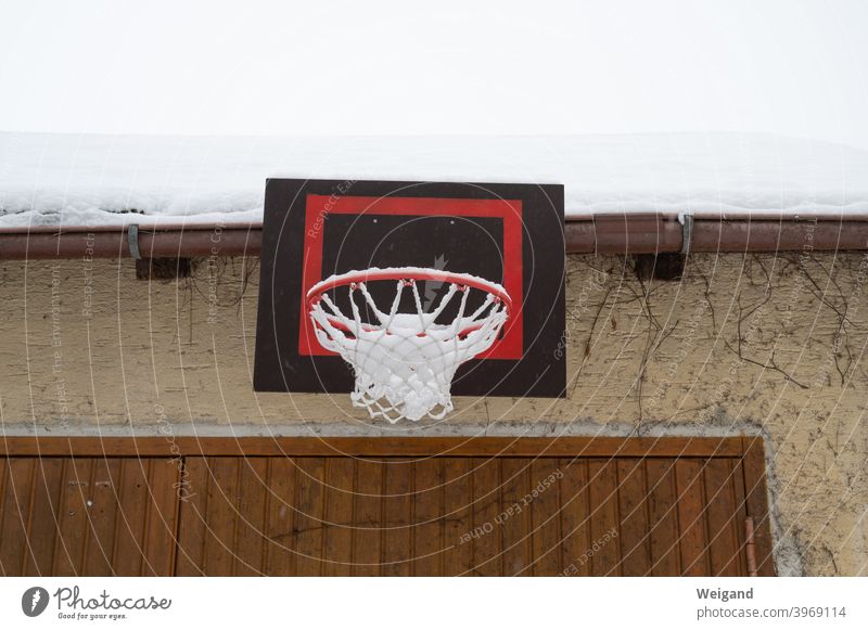Basketball hoop in winter lockdown Basketball basket Infancy Sports Backyard Winter Snow bleak Gloomy Boredom Cold youthful