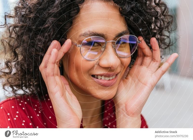 Cheerful young woman in eyeglasses - a Royalty Free Stock Photo from  Photocase
