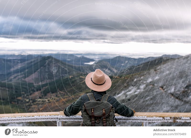 Unrecognizable senior traveler at viewpoint in mountains man observe highland winter admire hiker male caceres extremadura spain amazing hill tourism adventure