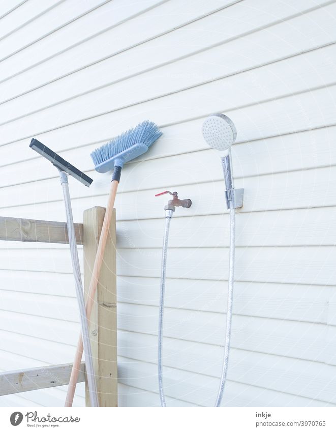Cleaning utensils outdoor Colour photo Exterior shot Deserted polish Broom Shower head shower Water hose Veranda Bright pale clean neat White Household