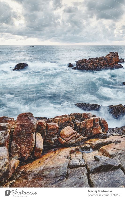 Rocky beach, color toned long exposure picture. sea rock water seascape wave ocean summer solitude filtered vacation sky no people nature coast island travel