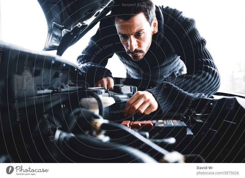 Man examines his car Car Hood test broken keep tabs on sb./sth. repair Broken Vehicle Testing & Control annoyed Sour