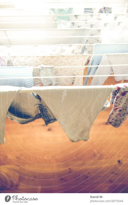 Laundry hangs on a clothes horse Hang Cotheshorse Household Washing day Dry garments hang out Photos of everyday life Clothing