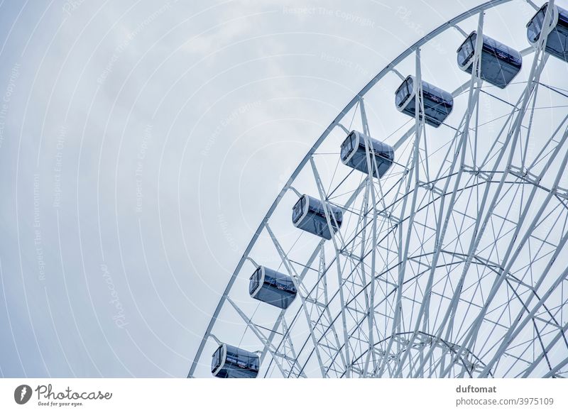 View from below Ferris wheel against the sky Steel minimal Steel construction Manmade structures Town Sky Gray lines Tall Loneliness Gloomy Deserted Round