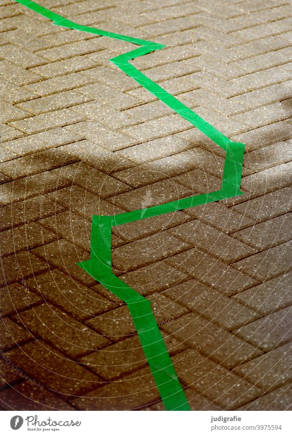 Zigzag in green on street pavement Line mark Marker line Green Street Lanes & trails off paving Paving stone paved Shadow Light Town Stone Border Pattern