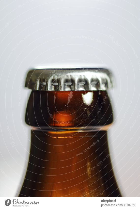 crown cork on a closed beer bottle Crown cap Crown cork Bottle Bottle of beer Closure Metal Glass Beverage Beer locked Brown Silver