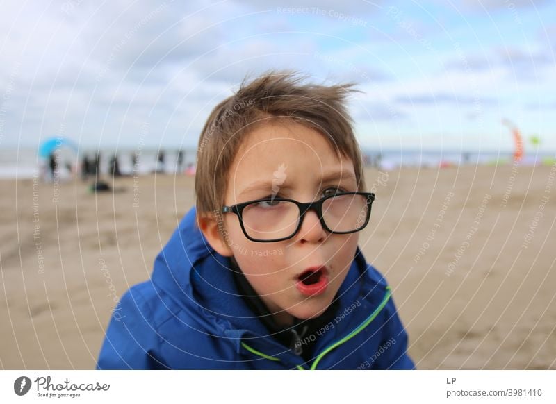 child shouting at the camera Looking into the camera Portrait photograph Upper body Sunlight Light Structures and shapes Exterior shot Multicoloured Aggression