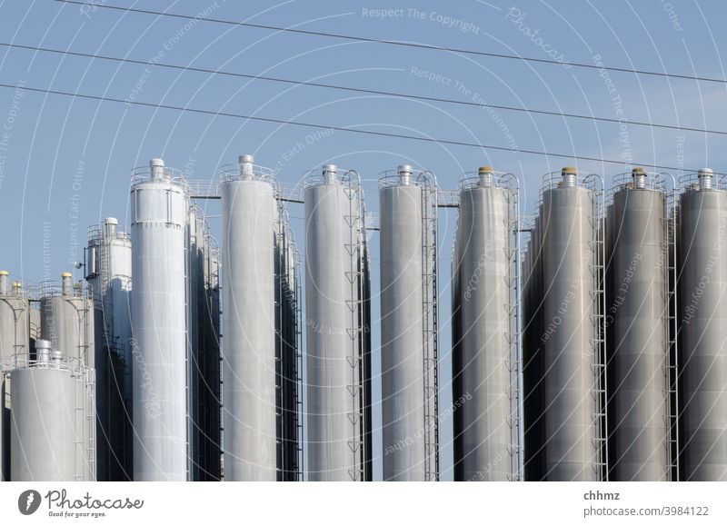 silos Silo Pipe Building Industrial Photography Blue Chemical Industry Factory Sky perpendicular Deserted Industrial plant High voltage power line Gloomy neat