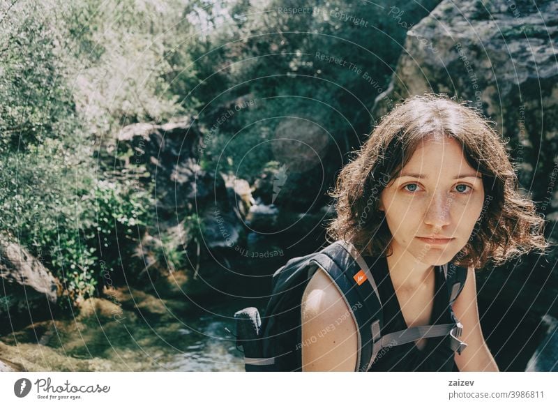 Girl sitting looking at camera in the mountains of Prades, Tarragona. la febró prades catalonia spain outdoor medium copy space color people female one person