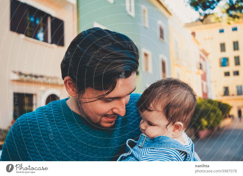 Adorable portrait of a young father hugging his baby happiness dad family love mask protect cute adorable parent parenthood single single dad childhood babyhood