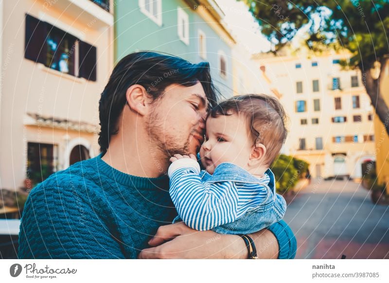 Adorable portrait of a young father hugging his baby happiness dad family love mask protect cute adorable parent parenthood single single dad childhood babyhood