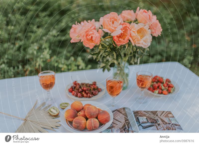 Summer snacks fruits healthy table set up flowers peonies lunch breakfast picnic Colour photo Breakfast Picnic Table Healthy Eating Diet Nutrition