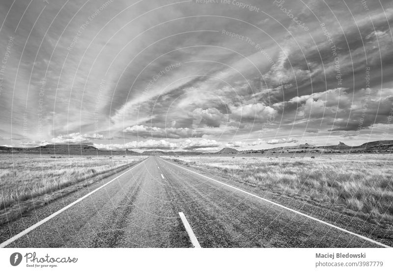 Black and white picture of scenic road in Canyonlands National Park, Utah, US. way America landscape black and white B&W highway travel journey road trip sky