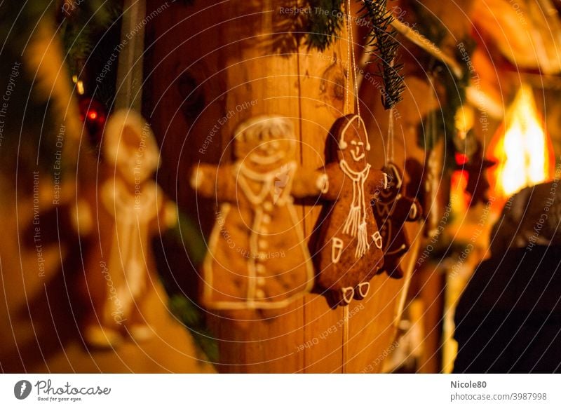 Gingerbread on wooden wall gingerbread Wood wooden beams Cozy Warm light christmas time fir branches Decoration christmas decoration crafted Home-made