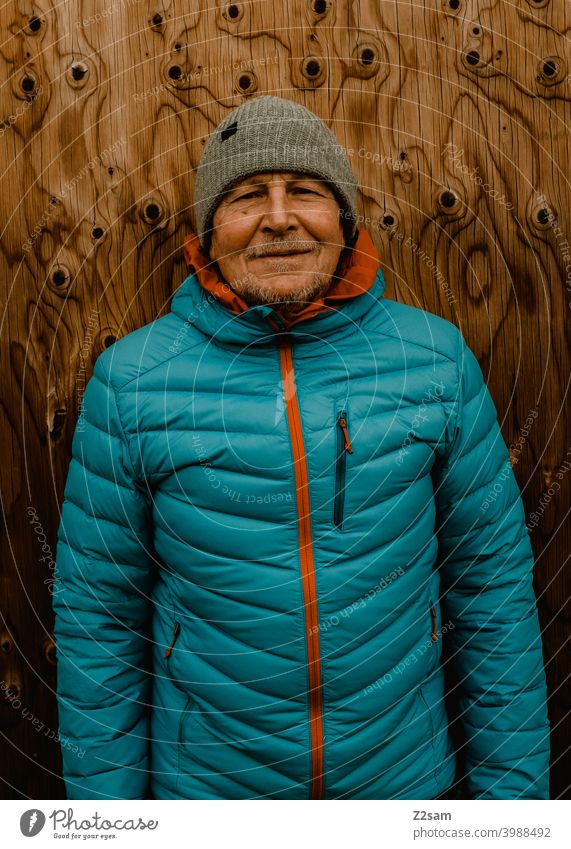 Portrait of a sporty pensioner Athletic Pensioners Man fortunate Facial hair Cap Jacket outtdoor Cool relaxed annuity Retirement Contentment Winter chill