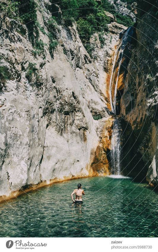 girl in the water in a waterfall in sadernes peaceful human perfect pure relaxing skin person enjoying paradise alternative happiness one person lady quiet