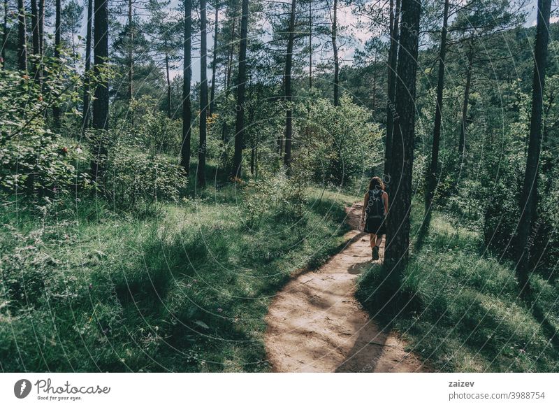 woman walking along a small path spain outdoor copy space color people female one person mountain freedom travel lifestyle nature healthy happiness hiking