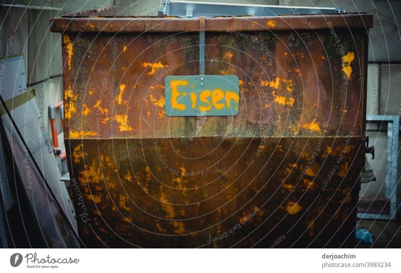 A rusty container only for iron waste, and a sign written by hand : Iron Container Logistics Colour photo Deserted Exterior shot Metal Sharp-edged