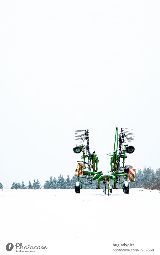 Winter boredom - rake stands lonely in the snow windrower Agriculture Agricultural machine arable land Tractor Landscape Work and employment Machinery Vehicle