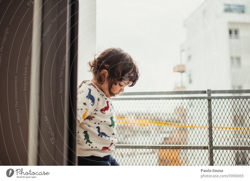 Cute little girl playing on the balcony Balcony Child childhood at home Day Quarantine stay at home Family & Relations Light Interest Colour photo Infancy