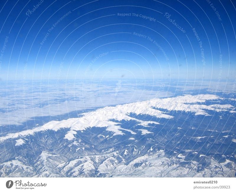 Winter from above Carpathians Aerial photograph Aviation Colour Snow Blue Sky Mountain
