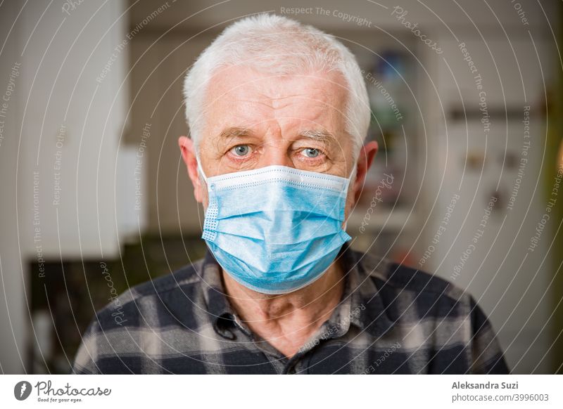 Senior man in protective mask staying home during pandemic lockdown. adult aged assistance breathing care coronavirus covid-19 disease distance elderly epidemic
