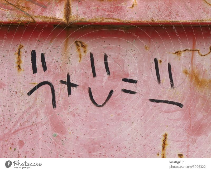 Equation in picture language with emoticons Graffiti emotion Facial expression Face Wall (barrier) Wall (building) plus sign equal sign Exterior shot
