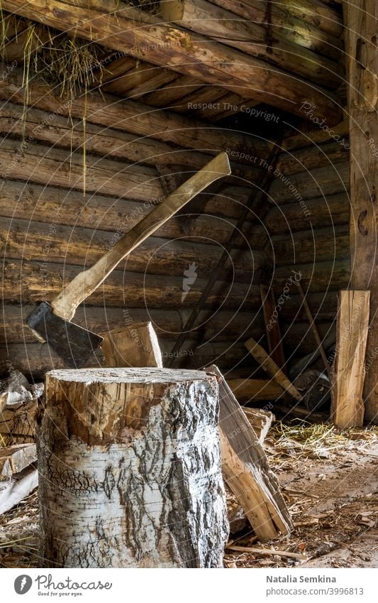 Axe splitter stuck in birch log in village wooden yard. Real village life picture, cottagecore. axe chop autenthic nobody bark blade cleave day firewood forest