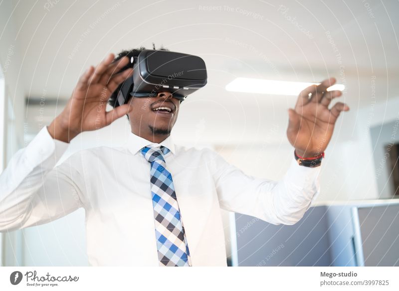 Businessman using VR glasses. businessman vr virtual reality headset concept indoors entertainment equipment simulation electronic job work company workplace