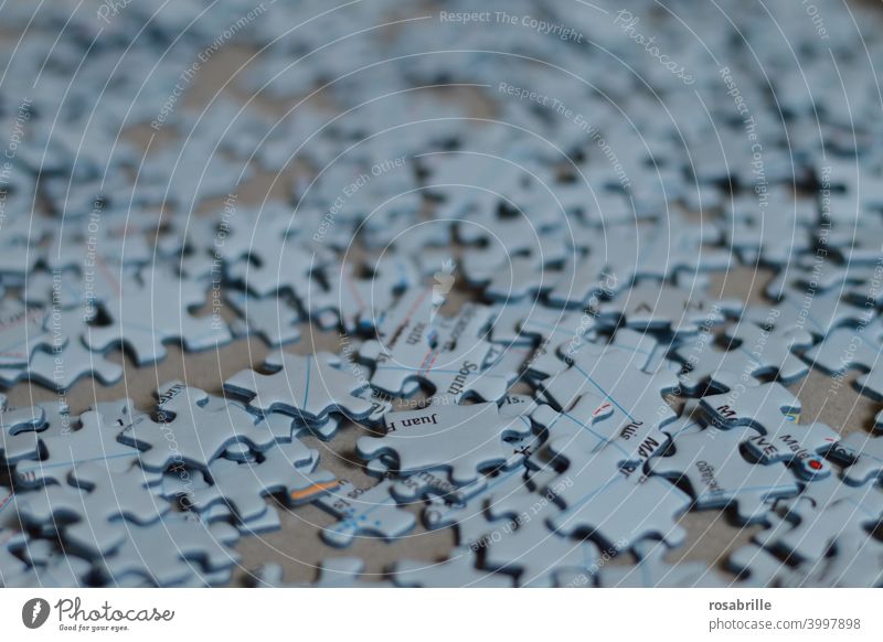 Spaces | Pieces of the puzzle in a heap Puzzle Puzzle Pieces do a jigsaw puzzle Heap put together game puzzle game Playful search Find skill Dexterity patience