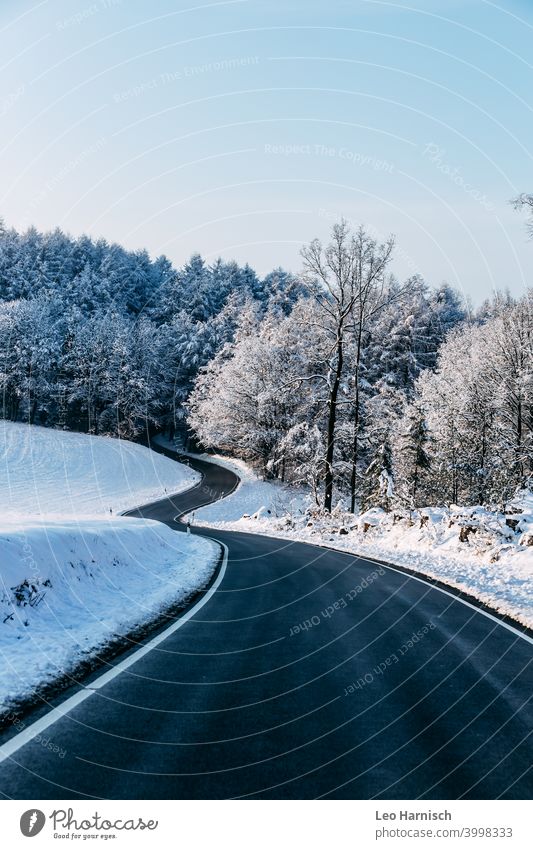 Winding road in winter Street Snow Traffic infrastructure Landscape Frost White Nature Deserted Winter Environment Forest Cold Tree Snowscape Winter mood