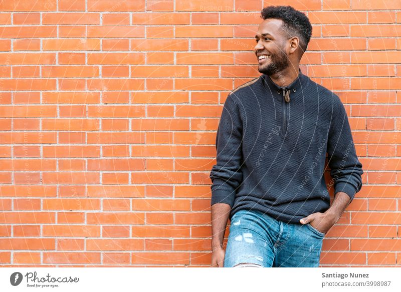 Portrait of Happy of Black Man front view portrait black afro african american one person street outside pose smiling smile fun look looking posing