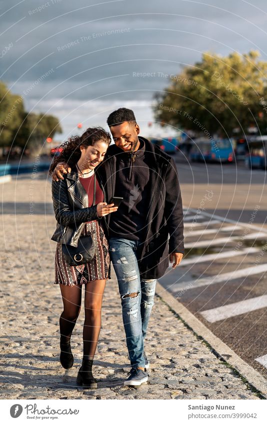 Happy Couple Using Phone couple relationship using phone interracial couple black afro african american cellphone diversity multi-racial black man ethnic