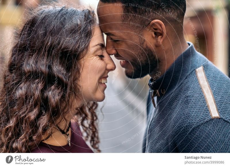 Interracial Couple Kissing closeup closeness couple interracial couple kissing afro african american smile relationship lovely detail black multi-racial