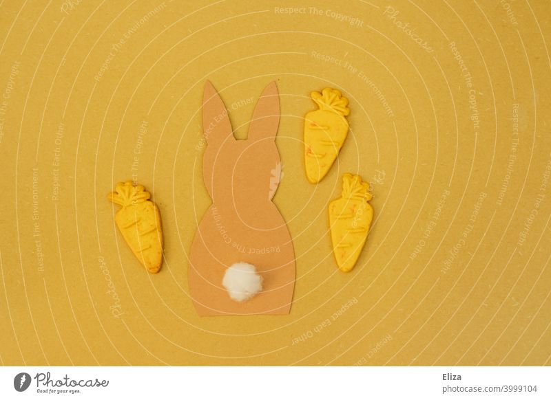 Bunny with carrots on yellow background. Easter. rabbit flatlay Easter Bunny biscuits Yellow Orange concept Decoration Easter decoration