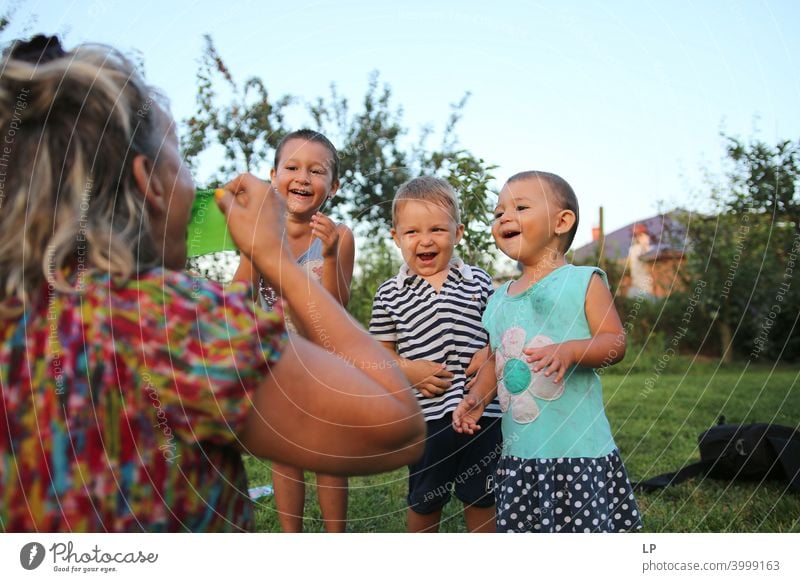 three children having fun, laughing at an adult, making fun fun factor fun action funny," Joy Funny Action Happy Playing Summer Human being normal people