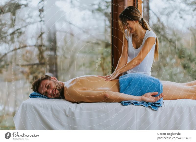 https://www.photocase.com/photos/4001400-handsome-young-man-lying-and-having-back-massage-in-spa-salon-during-winter-season-photocase-stock-photo-large.jpeg