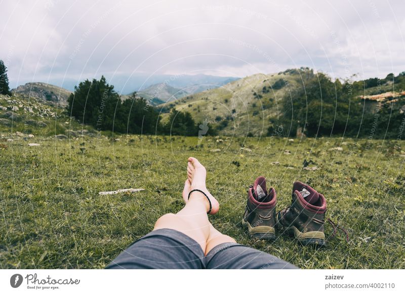 bare feet resting after climbing a mountain horizontal toe peaceful recovery relaxing solitude tranquility copy-space naked serene skin well wellbeing foot