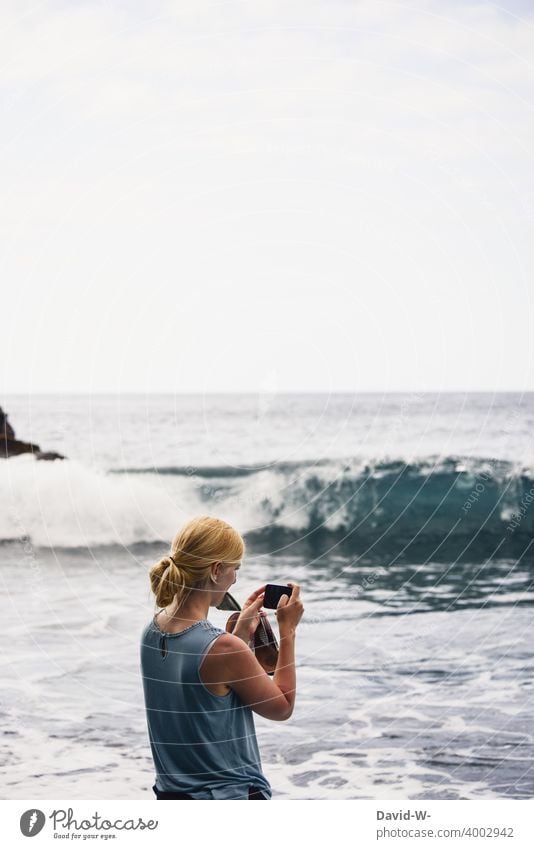 Holiday photo - woman photographing the sea vacation Take a photo souvenir Memory Cellphone Ocean Vacation photo Vacation good wishes Woman camera