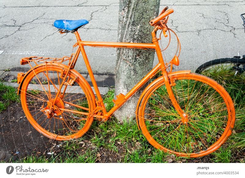 Bicycle orange Orange Cycling cyclists Transport orange bike Lean Break Wheel Trip plain Unicoloured Parking Mobility Exceptional