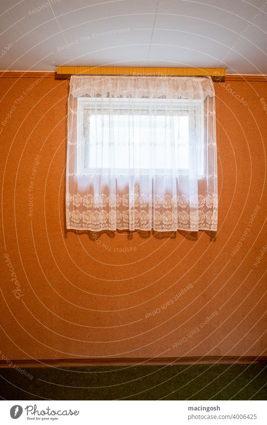 Room (ground floor) with small window and curtains sober Orange Retro vintage Curtain Old fashioned Drape Deserted Living or residing Decoration Interior shot