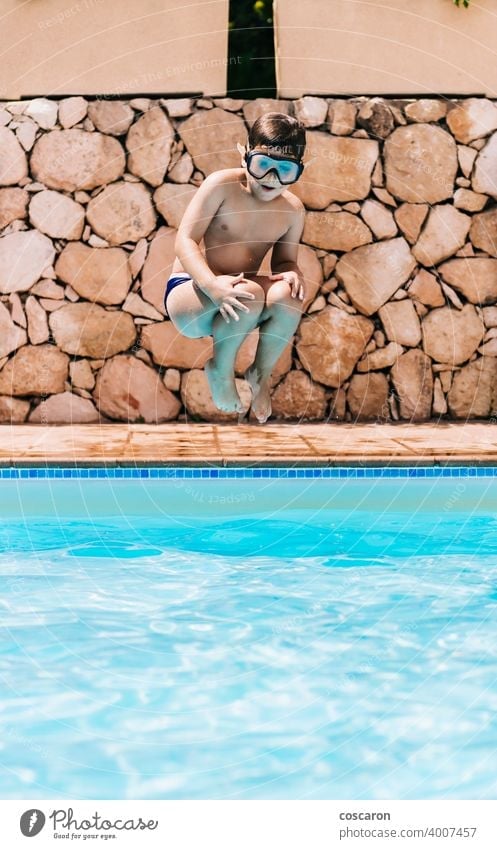Little child jumping into a pool active activity adorable blue boy bright cheerful childhood cute energetic fun girl glasses handsome happiness happy healthy