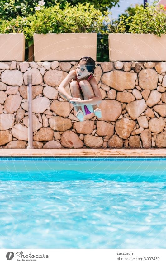 Little child jumping into a pool active activity adorable blue boy bright cheerful childhood cute energetic fun girl glasses handsome happiness happy healthy