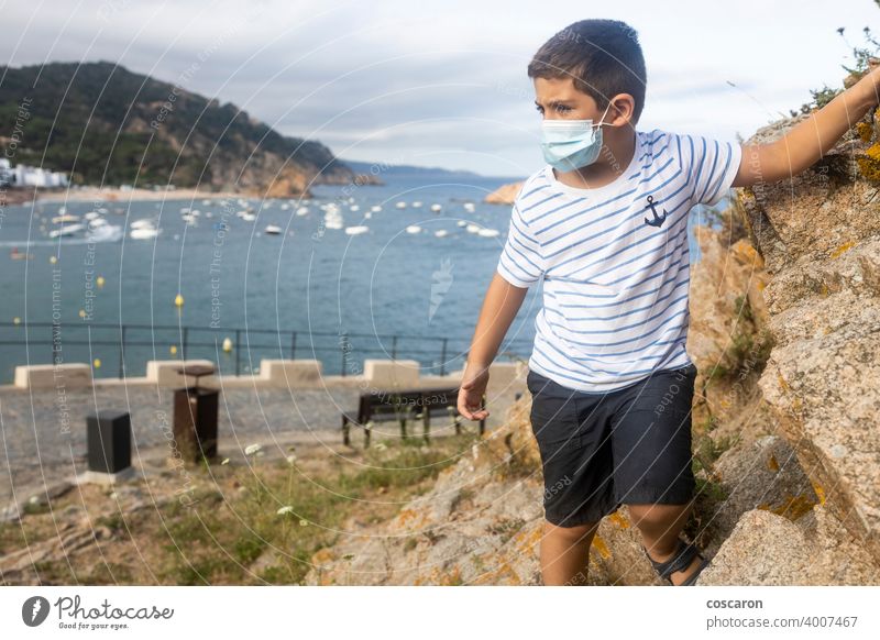 Child on vacation on the coast near the sea 2019-ncov baby beach beam boy caucasian child childhood corona corona virus coronavirus covid-19 epidemic face