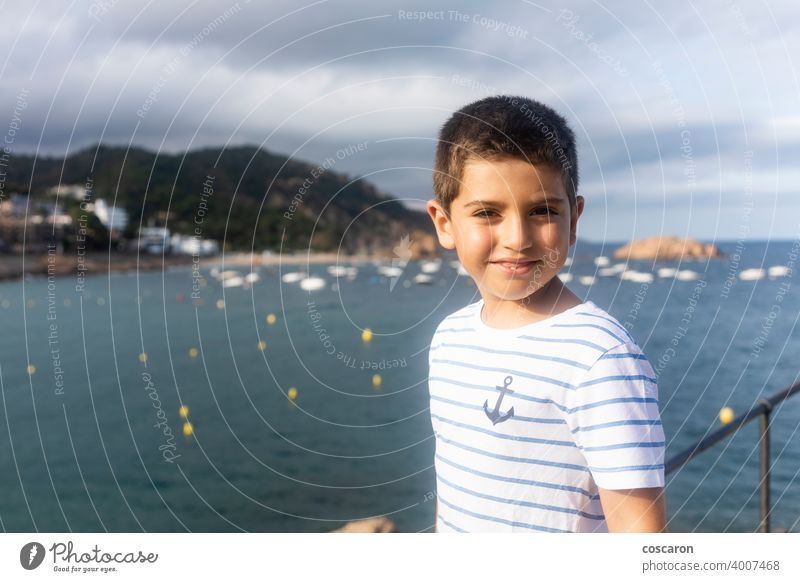 Child on vacation on the coast near the sea 2019-ncov baby beach beam boy caucasian child childhood corona corona virus coronavirus covid-19 epidemic face