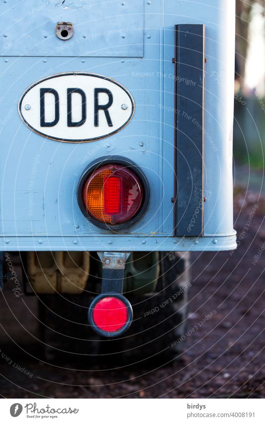 oval tin sign with country code DDR on an old truck. german democratic republic GDR Country code German Democratic Republic Past car lorry Signs and labeling
