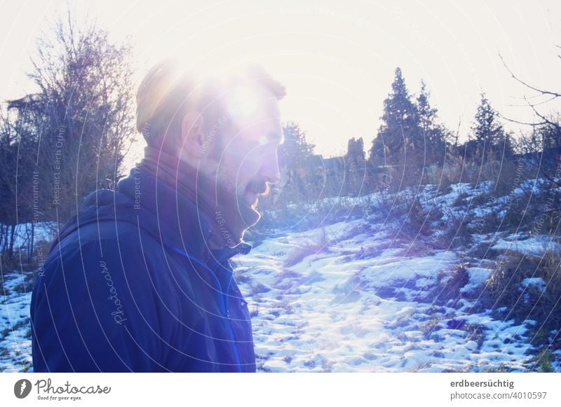 Man in cold winter landscape with sun rays cap Winter Cold Landscape profile picture Blue White Frost Sun Scarf mustache Light Ice chill Freeze Exterior shot