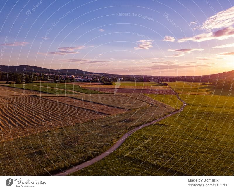 Bird's eye view of sunset in Happurg with fields and mountains in the background Sunlight Sunset Bird's-eye view UAV view droning Available Light Moody